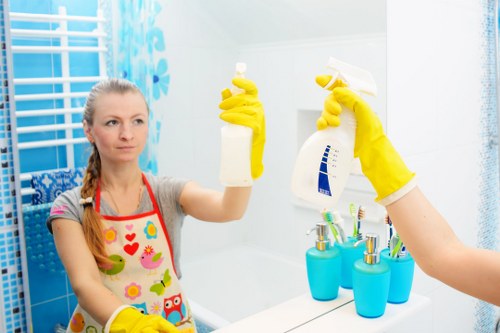 Professional cleaner tidying a modern Brisbane home